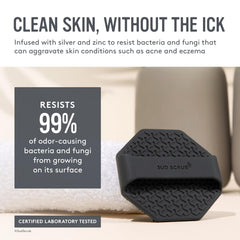 Sud Scrub Charcoal Face Scrubber held in hand showing non-slip grip for secure scrubbing.