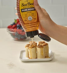 Closeup of Sue Bee honey jar showing golden amber color and clarity.