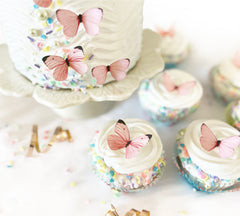 Sugar Robot edible butterfly cake toppers pastel pink for elegant cupcake accents.