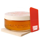 Sugardoh sugar wax kit bottle shows convenient at-home use with ready-to-apply paste.