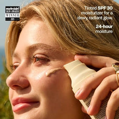 Sun Bum Daily Glow SPF 30 bottle photographed for travel-ready protection.