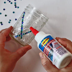 Crystal-clear glue supports rhinestone embellishments on clothing