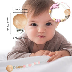 Close-up of Suptizizkz wooden pacifier clip showing smooth finish.