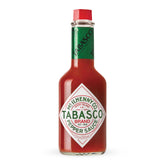TABASCO Original Red bottle on shelf, a timeless pantry staple for bold flavor.