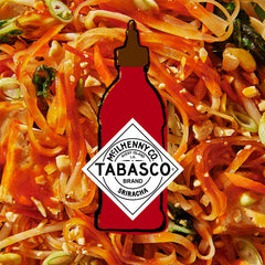 Noodles with Sriracha drizzle delivering sweet heat and garlic finish