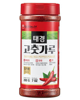 Taekyung chili powder flakes in a 7oz bottle for kimchi and Korean cooking.