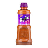 Tajín Twist bottle ready to sprinkle on fruits for a tangy kick.