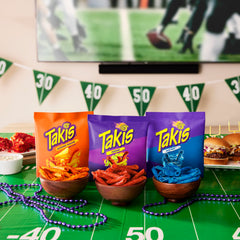 Takis Intense Nacho bag close-up with cheese notes
