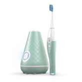 Tao Clean seaglass green UV station dock sanitizing and charging the toothbrush.
