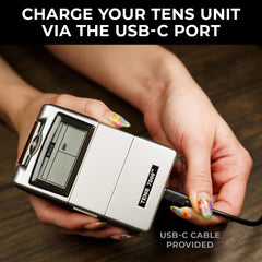 TENS 7000 charging dock showing rechargeable setup for uninterrupted therapy
