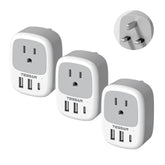 TESSAN UK travel adapter 3-pack on table, compact and travel-ready for hotel setups.