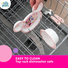The First Years Minnie Mouse spoon with toddler-friendly handle supports independent eating.