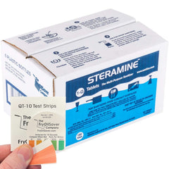 Steramine tablets dissolving in water to form a ready sanitizing solution.