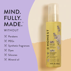 The Honest Company lavender calming oil being massaged for a relaxing bedtime routine.