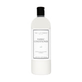 The Laundress Isle Fabric Conditioner bottle softens fabrics with Isle scent