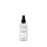 The Laundress Wool and Cashmere Spray bottle with cedar scent refreshing knits between washes