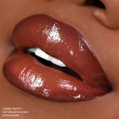 The Lip Bar jojoba oil vitamin E essence emphasizes nourishing formula on lips.
