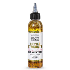 The Mane Attraction Extra Strength Rosemary Fenugreek Oil bottle pour nourishes the scalp and hair health.