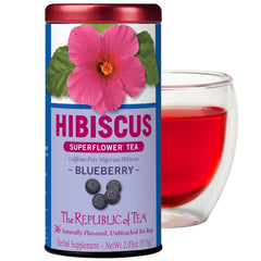The Republic of Tea Hibiscus Blueberry Superflower tea bag tin front view, premium caffeine-free refreshment.