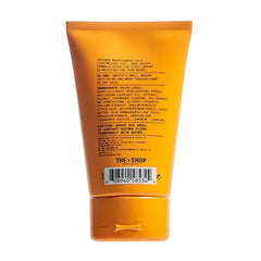 The Shop Uninterrupted beard cream texture close-up shows rich, non-greasy coverage.