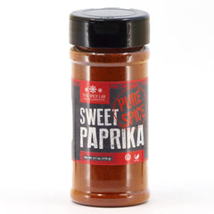 The Spice Lab Sweet Paprika Powder bottle shows vibrant red color for paella.