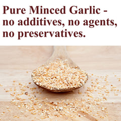 The Spice Way dehydrated garlic flakes closeup showing coarse texture for richer flavor.