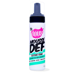 The Doux Curly-Definition Mousse bottle demonstrates flexible hold for defined curls.