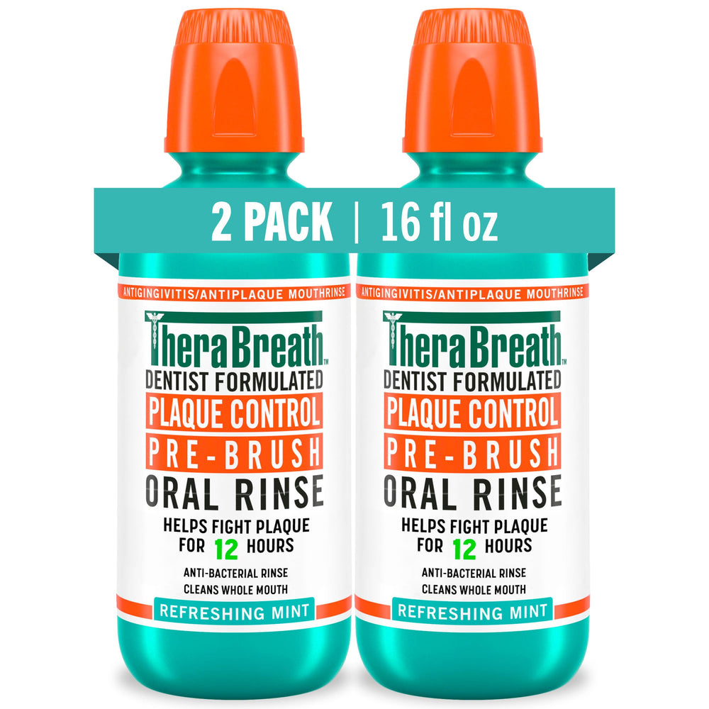 TheraBreath Plaque Control bottle pour showing minty pre-brush rinse for fresh breath