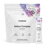 THORNE Amino Complex Berry bottle on gym bench supports lean muscle and recovery