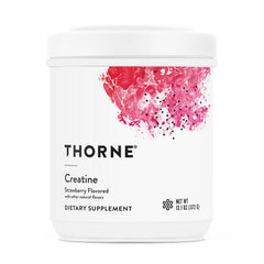 THORNE Creatine strawberry powder scoop ready for mixing to boost training energy.