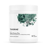 THORNE Daily Greens Plus mint powder in a glass for refreshing daily nutrition
