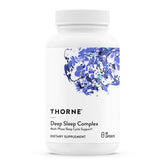 Thorne Deep Sleep Complex bottle on nightstand promotes evening relaxation.