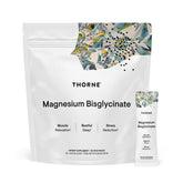 THORNE Magnesium Bisglycinate bottle on a kitchen counter, supporting daily wellness.