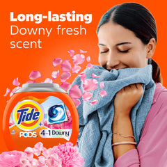 Close-up of Tide PODS with Downy April Fresh showing built-in stain removers.