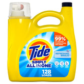 Tide Simply Refreshing Breeze bottle pouring for a stain-fighting wash