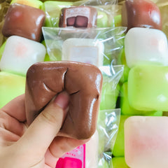 TIM CHESS sticky bread squishy in vibrant colors, bright desk decor
