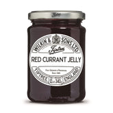 Tiptree Red Currant Jelly jar with a glossy spread, ideal for toast.