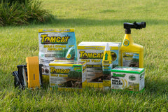 Tomcat Mole Killer ready-to-use bait on lawn for straightforward runway treatment.