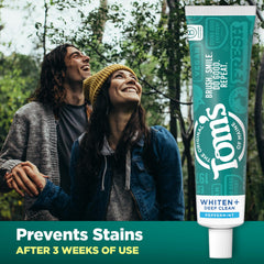 Tom's of Maine Whiten Plus Deep Clean beside toothbrush ready for brushing.