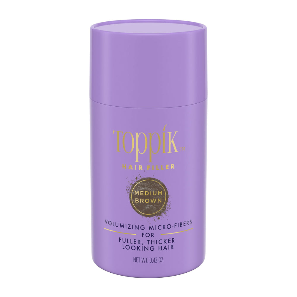 Toppik Hair Filler Medium Brown bottle applied at the hairline for natural fullness