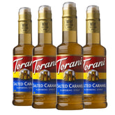Torani Salted Caramel syrup bottle on kitchen counter, ready to flavor coffee.