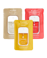 Touchland Hydrating Sanitizer Mist Mango Passion bottle close-up, refreshing moisturization for hands