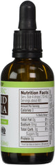 Pouring Trader Joe's Organic Liquid Stevia into coffee for natural sweetness