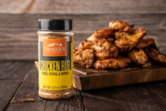 Traeger grilling chicken with rub on breast for enhanced aroma and color