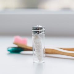 TreeBird Pure Silk Eco Floss in a clear glass dispenser shows floss level.