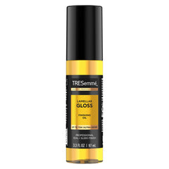 TRESemmé Lamellar Gloss Oil bottle being poured for a sleek, shiny finish.