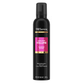 TRESemmé Plumping Mousse bottle close-up showing amplified volume for lasting lift