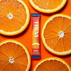 TREVI Sugar Free Electrolytes Orange bottle close-up highlighting zero sugar.