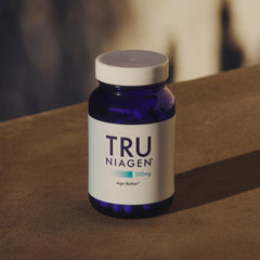 TRU Niagen bottle on table emphasizes daily NAD+ support.