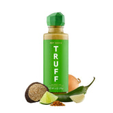 TRUFF Jalapeño Lime Hot Sauce bottle being poured for bold flavor.